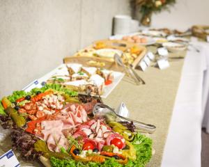 a buffet line of food on a table at Apartmány PANORAMA Bachledka in Ždiar +30 photos