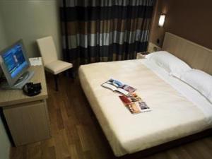 Ένα ή περισσότερα κρεβάτια σε δωμάτιο στο Hotel Dei Vicari