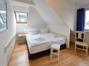 Postel nebo postele na pokoji v ubytování Villa Strandidyll - WG13 mit Meerblick