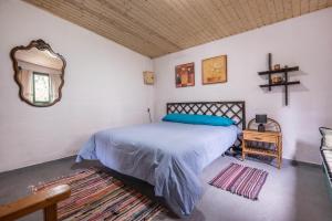 Tempat tidur dalam kamar di Casa rural Teno Alto