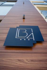 a blue sign on the floor of a building at Hotel B4 in Oradea