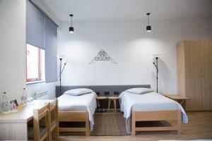 Llit o llits en una habitació de KASA guesthouse Gyumri