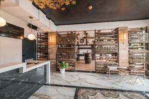 a wine tasting room with a wall of wine racks at Barjaktar - Luxury Suites & SPA in Ulcinj