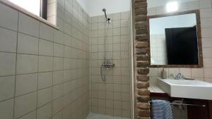 a bathroom with a sink and a mirror at Villa Cabanas de Tavira by Sunny Deluxe in Tavira +34 photos