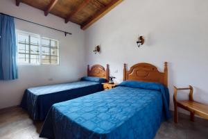 Postel nebo postele na pokoji v ubytování Casa El Cardon A1
