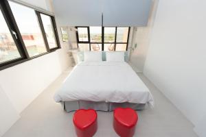 Voodi või voodid majutusasutuse Discovery B&B toas