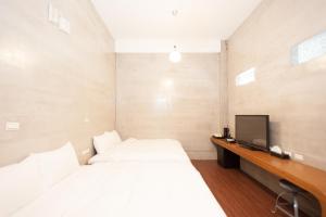 Voodi või voodid majutusasutuse Discovery B&B toas