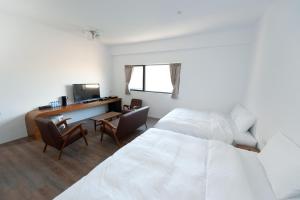 Voodi või voodid majutusasutuse Discovery B&B toas