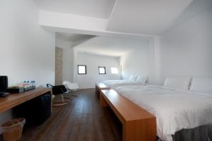 Voodi või voodid majutusasutuse Discovery B&B toas