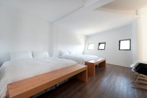Voodi või voodid majutusasutuse Discovery B&B toas