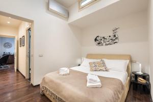 Posteľ alebo postele v izbe v ubytovaní Art Gallery Apartment in Florence