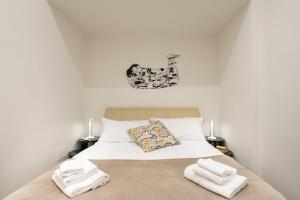 Posteľ alebo postele v izbe v ubytovaní Art Gallery Apartment in Florence