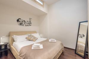 Posteľ alebo postele v izbe v ubytovaní Art Gallery Apartment in Florence