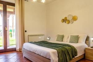 Posteľ alebo postele v izbe v ubytovaní Villa San Biagio + 13 fotografií