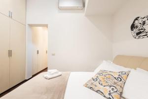Posteľ alebo postele v izbe v ubytovaní Art Gallery Apartment in Florence