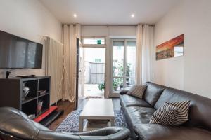 Televízia a/alebo spoločenská miestnosť v ubytovaní Art Gallery Apartment in Florence