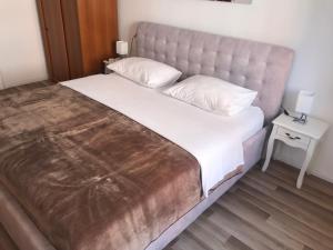 Postel nebo postele na pokoji v ubytování City Core Apartment