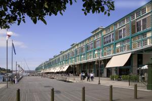 a large building with people walking in front of it at Ovolo Woolloomooloo in Sydney