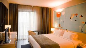Voodi või voodid majutusasutuse Hotel 3K Barcelona toas