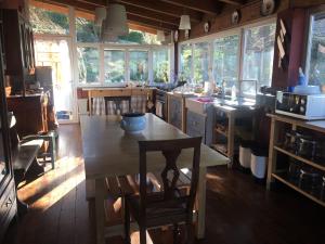 a kitchen with a table and chairs in a room at CASA IL GLICINE in Rocchetta Palafea