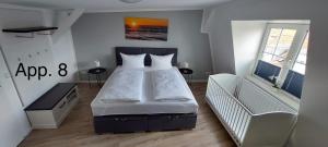 A bed or beds in a room at Altstadt Appartements