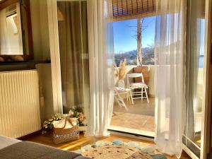 a room with a sliding glass door to a patio at Villa Persephone in Megali Ammos