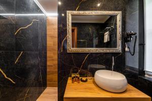 a bathroom with a white sink and a mirror at Ca' Maria Callas in Venice