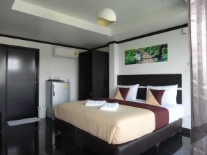 Postel nebo postele na pokoji v ubytování Sinsamut Koh Samed