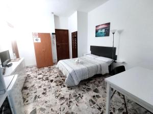 Un pat sau paturi într-o cameră la Locazione Turistica La Primula