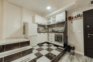 Kuchyň nebo kuchyňský kout v ubytování Spa Lux Apartmani