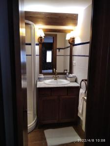 a bathroom with a sink and a mirror at Casa Rural Lahuerta in Bronchales