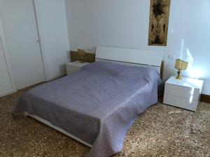 Łóżko lub łóżka w pokoju w obiekcie Casa Regini Venezia