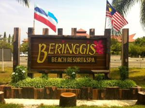 a sign for the entrance to the beach resort spa at Beringgis Beach Resort & Spa in Papar