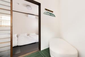 Uma cama ou camas num quarto em Hotel kiki