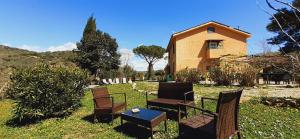 A garden outside DIMORA IL CAMALEONTE apartments in nature with pool