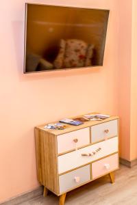 a dresser with a television on top of it at El Nido in Ajo