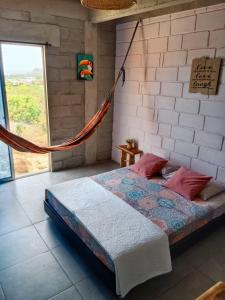 Un pat sau paturi într-o cameră la Kitesurf Hostal Ocean House-Santa Verónica