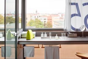 a kitchen with a sink and a window at Casa Camper Berlin in Berlin