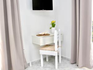 Televízia a/alebo spoločenská miestnosť v ubytovaní Cozy Flat at Regina Apartments