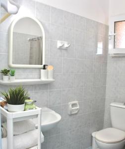 Kúpeľňa v ubytovaní Cozy Flat at Regina Apartments