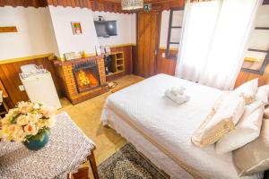 Giường trong phòng chung tại Pousada Cantinho De Monte Verde