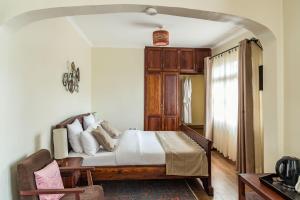 Postel nebo postele na pokoji v ubytování Villa Arumeru