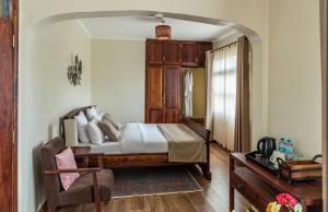 Postel nebo postele na pokoji v ubytování Villa Arumeru
