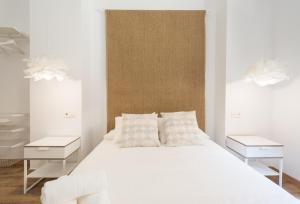 Łóżko lub łóżka w pokoju w obiekcie Santiago Premium loft I