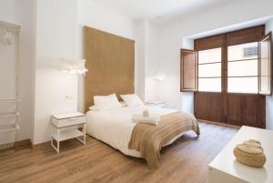 Łóżko lub łóżka w pokoju w obiekcie Santiago Premium loft I