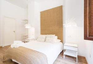 Łóżko lub łóżka w pokoju w obiekcie Santiago Premium loft I
