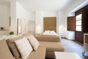 Łóżko lub łóżka w pokoju w obiekcie Santiago Premium loft I