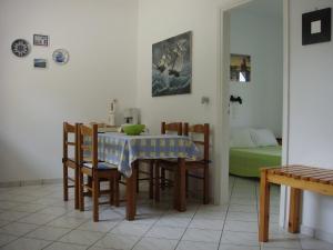 a dining room with a table and chairs at Eleftheria Studios and Apartments in Acharavi +46 photos