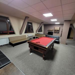 a room with a pool table and couches at Комплекс Шуменско плато in Shumen