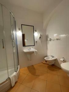 A bathroom at U Cervene zidle - Red Chair Hotel